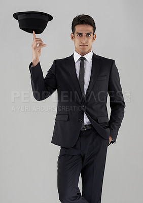 Buy stock photo Man, suit and hat in studio portrait with confidence, spin or corporate fashion by white background. Person, model and edgy clothes with balance, pride and black fabric in shirt, tie and professional