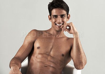 Buy stock photo Muscular, man and shirtless portrait in chair to relax in white background of studio. Happy, model and person with a smile for wellness, confidence and bodybuilder with a six pack from fitness