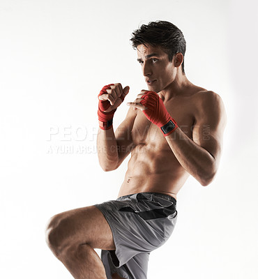 Buy stock photo Man, kick boxer and strong in gym, serious and face for workout, boxing or white background. Exercise, sports and training for power, self defense and concentrate for challenge, mma or fight skills
