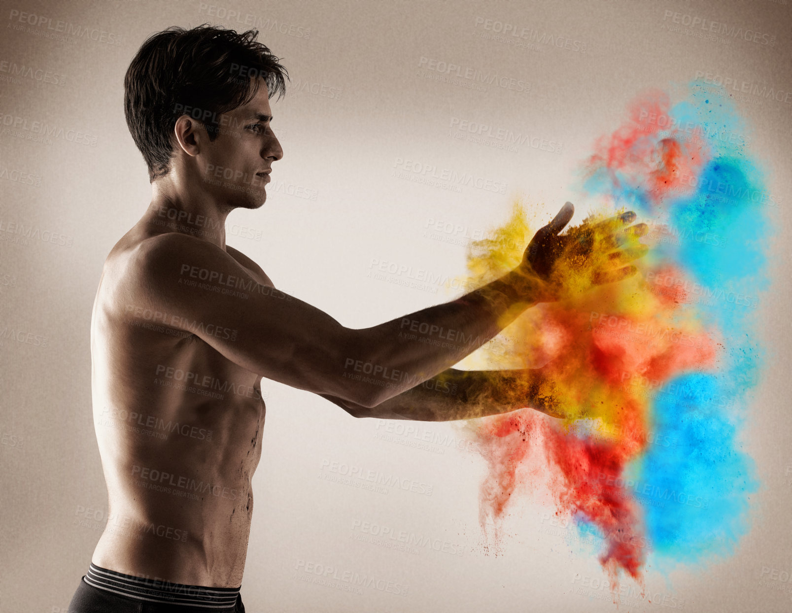 Buy stock photo Color, explosion and man with powder in hands with creativity, performance and studio. Vibrant, paint and shirtless model with bold cloud with blue, red and yellow smoke in background or backdrop
