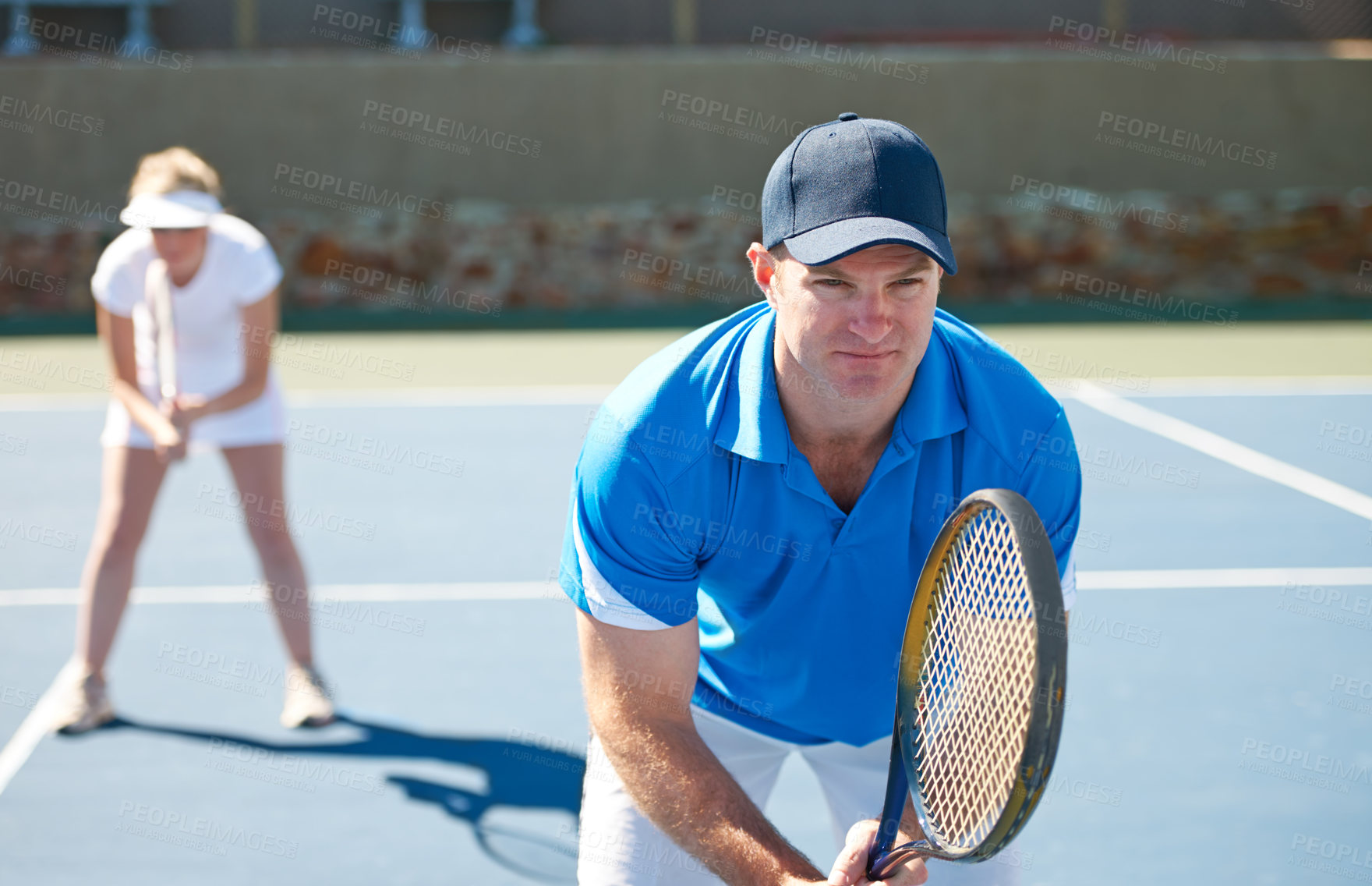 Buy stock photo Tennis match, couple and sports in outdoors, competition and playing on court at country club. People, training and exercise or ready for game, performance and practice or collaboration for challenge