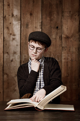 Buy stock photo Education book, think and child reading information, youth development study or literature story. Brainstorming, textbook and young kid, boy or student problem solving solution, idea or learning plan
