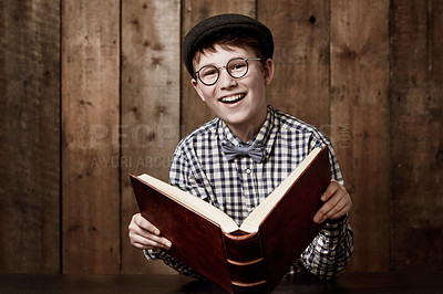Buy stock photo Learning portrait, book or young happy child, learner or pupil reading information, literature story or studying. Knowledge textbook, happiness or kid student education, literacy or research homework