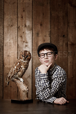 Buy stock photo Young child, portrait and confident with thinking by owl, pride and vintage fashion with glasses in mockup. Boy, face and nerd with wise bird in retro clothes with eyewear, contemplation and smart
