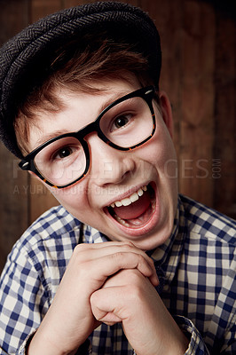 Buy stock photo Glasses, portrait and happy for boy in funny comic and vintage fashion in eyewear by wooden background. Child, face or laughter for comedy or retro clothes, spectacles or joke for smart for vision