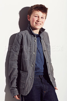 Buy stock photo Teenager, fashion and portrait of boy in studio, white background and happiness. Cool, style and child with a smile, pride and confidence in trendy clothes, outfit and personality on backdrop