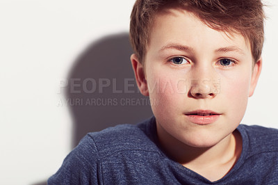 Buy stock photo Cropped portrait of a young preteen boy against a white background