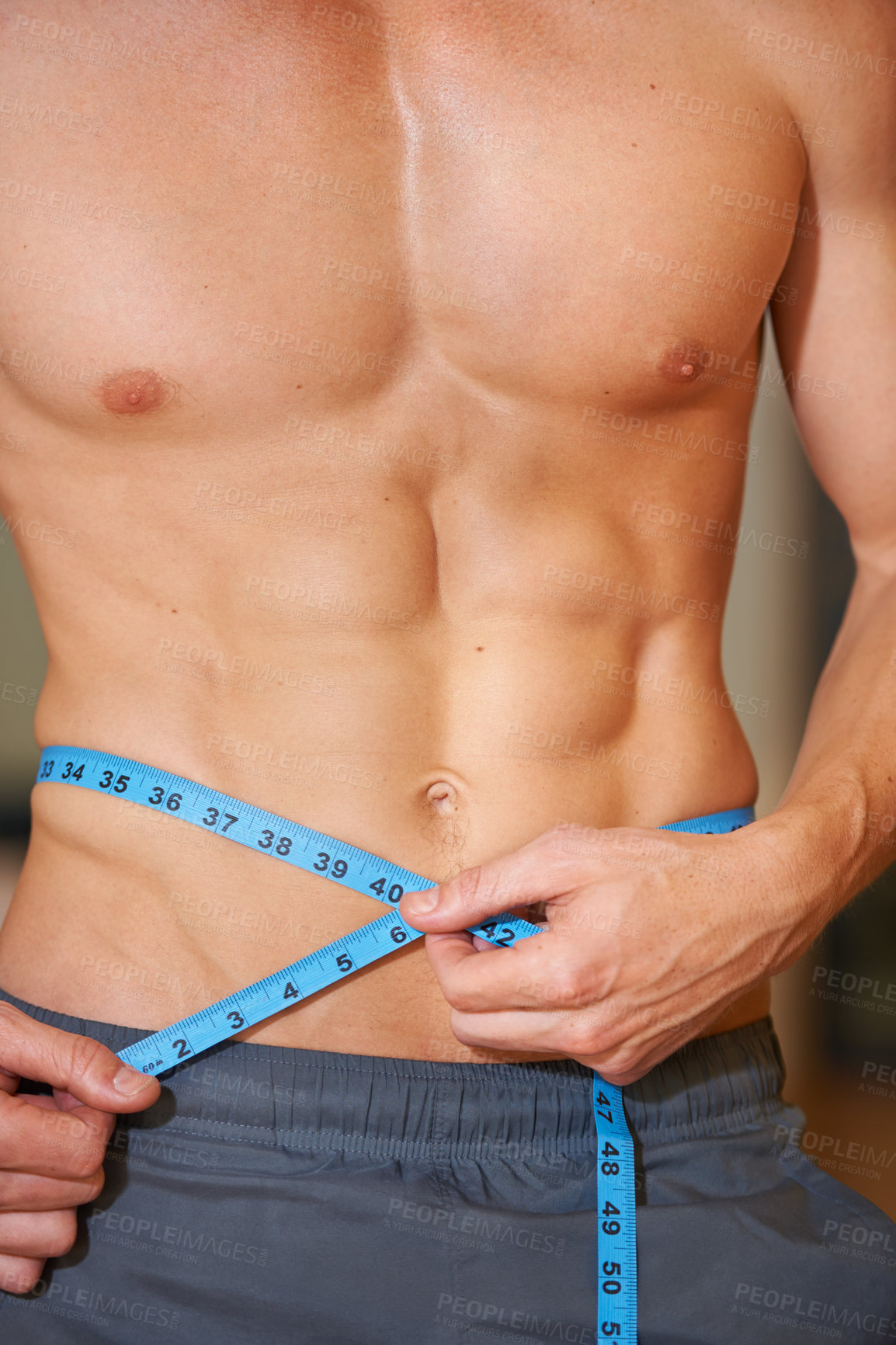 Buy stock photo Man, measuring tape and abdomen muscle in closeup for growth development or check results in gym. Person, bodybuilder or review progress in training, strong or stomach for wellness, health or fitness