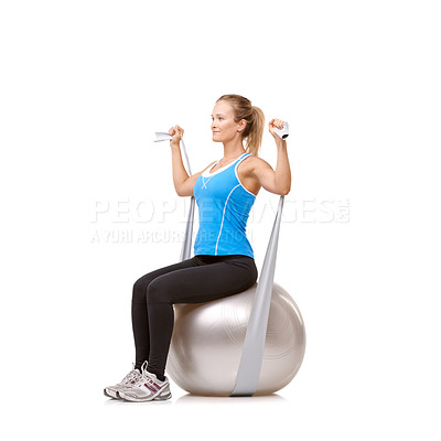 Buy stock photo Yoga ball, resistance band and woman doing workout in studio for health, wellness and body care. Sports, fitness and young female person from Canada with arms exercise or training by white background