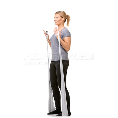 Buy stock photo A young blonde woman exercising with a resistance band - profile