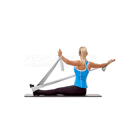Buy stock photo Sport, resistance band and woman doing exercise in studio for health, wellness and bodycare. Fitness, yoga mat and young female person from Australia with arms workout or training by white background