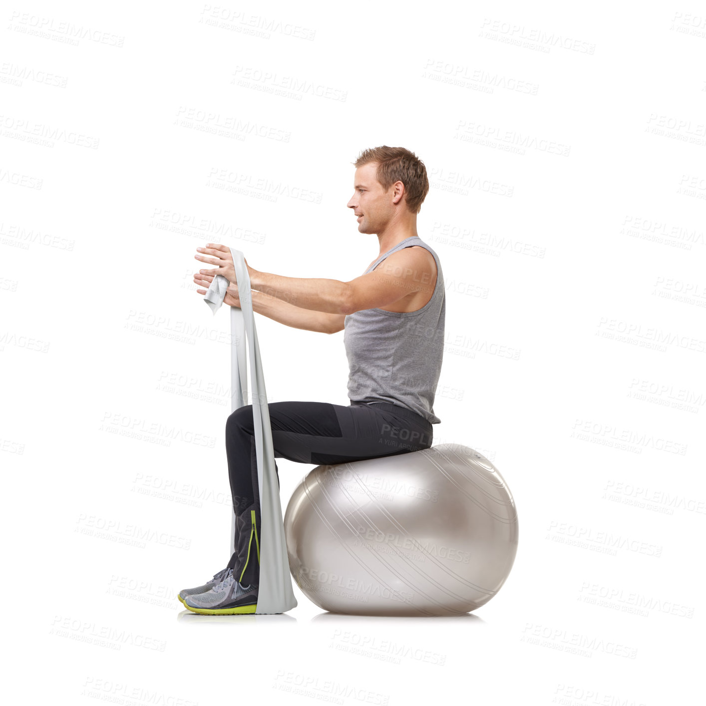 Buy stock photo Yoga ball, resistance band and man doing workout in studio for health, wellness and bodycare. Sport, fitness and young male person from Australia with arms exercise or training by white background.
