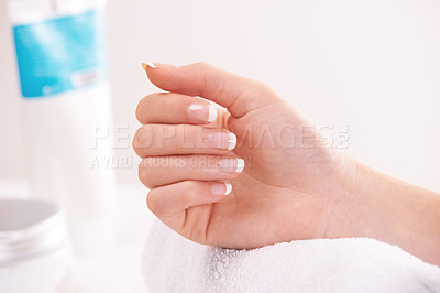 Buy stock photo Woman, hands and french manicure in beauty salon, spa and cosmetic care, skincare and tips. Natural growth, luxury and treatment for hygiene, closeup and nail parlour with towel, clean or maintenance