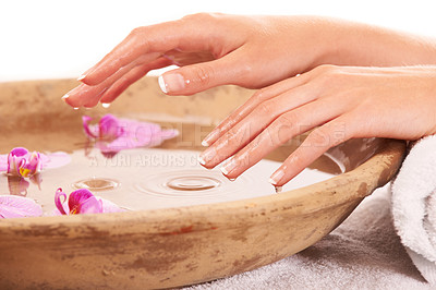 Buy stock photo Woman nails, hands and water for manicure, skincare or cosmetics in zen, beauty or salon spa treatment. Closeup of female person wet fingers in bowl of natural mineral liquid with flowers in wellness