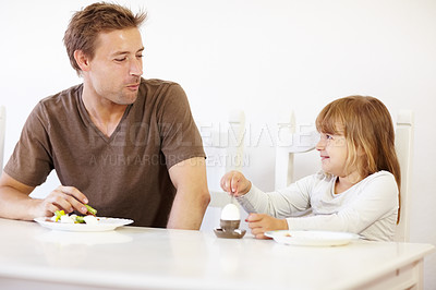 Buy stock photo Breakfast, father and daughter eating in the kitchen of their home together for morning nutrition. Food, boiled egg or meal with a man and girl child enjoying a healthy snack in their apartment