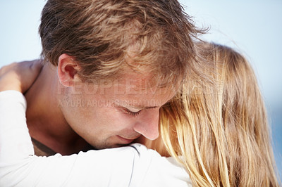 Buy stock photo Family, love or hug with a father and daughter on the beach together for relationship or summer bonding. Kids, trust or security with a man embracing his girl child outdoor on vacation or holiday