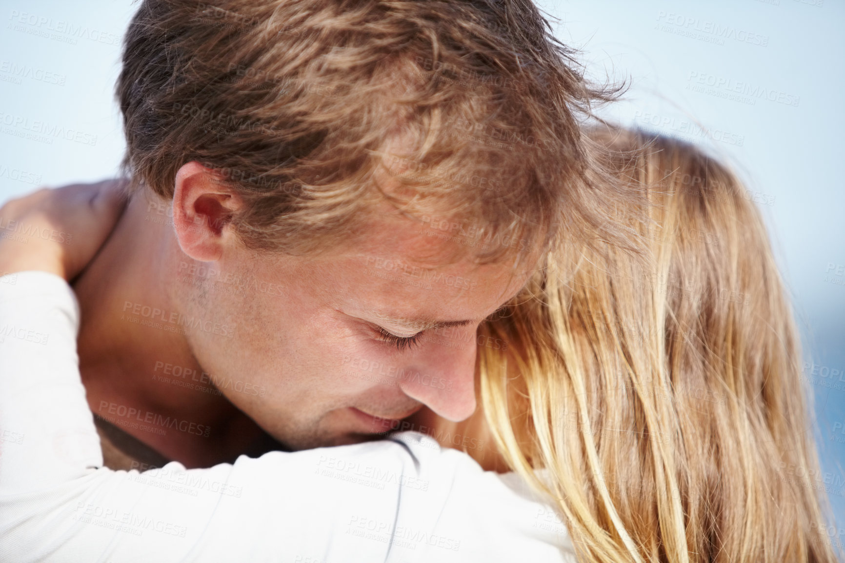 Buy stock photo Family, love or hug with a father and daughter on the beach together for relationship or summer bonding. Kids, trust or security with a man embracing his girl child outdoor on vacation or holiday