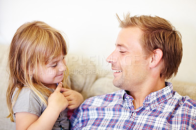 Buy stock photo Smile, conversation and father with child on a sofa relaxing, talking and bonding together. Happy, love and young dad speaking to sweet girl kid from Australia in the living room of modern home.