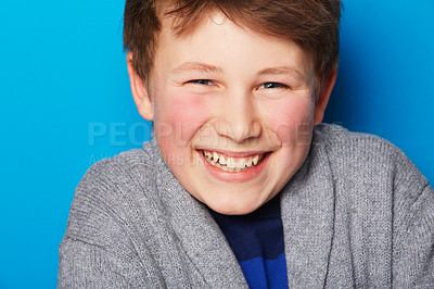 Buy stock photo Portrait of a young boy on a blue background