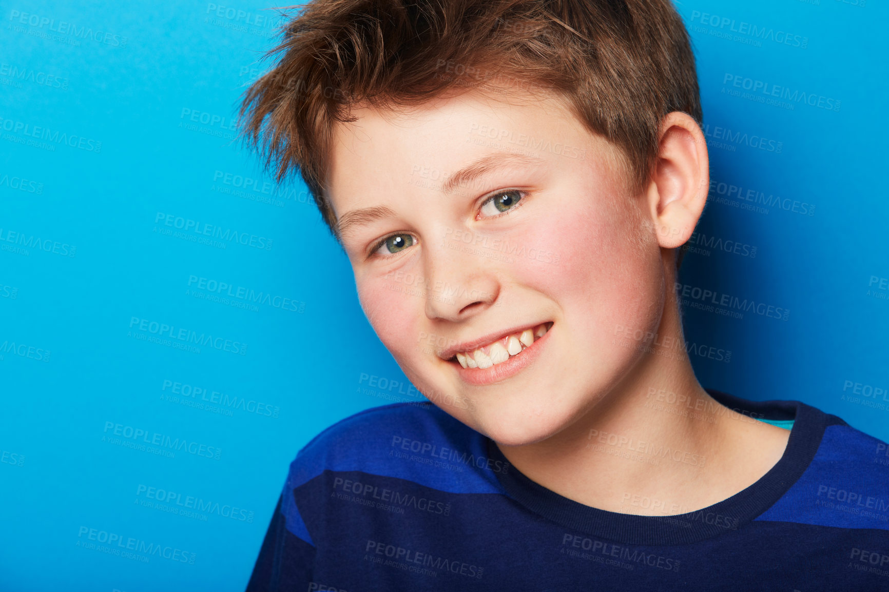Buy stock photo Portrait of a young boy on a blue background