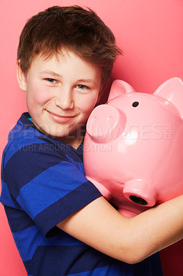 Buy stock photo Happy boy, portrait smile and piggy bank for investment, savings or coins against a pink background. Little child or kid holding piggybank and smiling for financial freedom, money or growth in profit