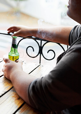 Buy stock photo Outdoor, smoking and man with a beer, relax and weekend break at a restaurant, alcohol and pub. Person, outside and guy with cigarette, tobacco and drink with habit, bottle and peaceful with smoker