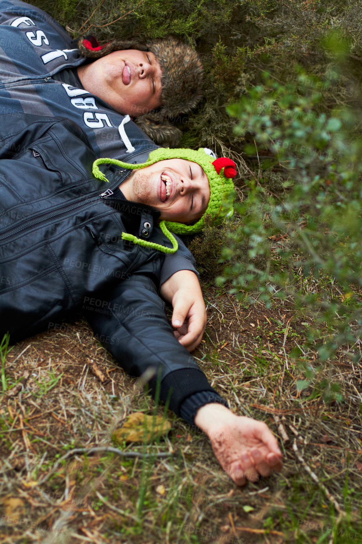 Buy stock photo Drunk, hangover and boys with friends sleeping outdoor on a field together in the morning after a party. Grass, tired or alcoholism with a plus size man and friend asleep on the ground in a park