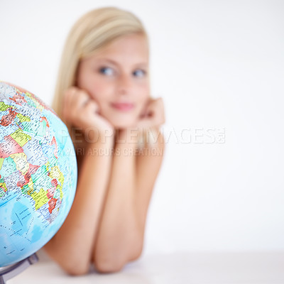Buy stock photo Globe, earth and a woman thinking about travel in studio on a blurry white background for freedom. Planet, map or atlas and a tourist with an idea for a holiday or vacation destination on the world