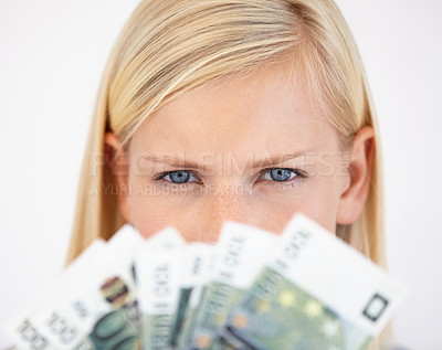 Buy stock photo Eyes, finance and woman serious about money in studio on a white background for tax, salary or increase. Accounting, economy or payment and a young person with cash for bank savings or growth