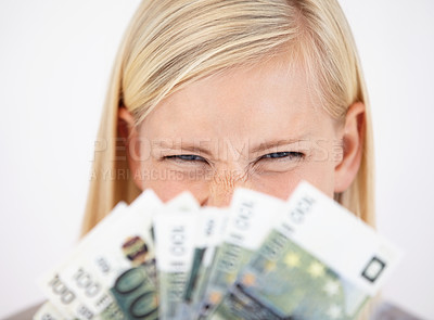 Buy stock photo Money, finance and lottery winner with a woman closeup in studio on a white background for profit or increase. Eyes, economy or investment and an excited young person with cash for financial freedom
