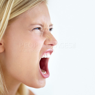 Buy stock photo Angry, face or woman screaming in studio at mockup space for crisis, mad emoji or reaction on white background. Frustrated model, shouting or voice of anger, emotional conflict or negative expression