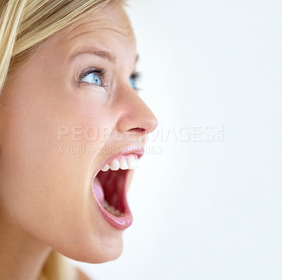 Buy stock photo Closeup of a pretty young blonde screaming at somebody to watch out