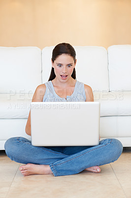 Buy stock photo Surprise, woman and sitting with laptop on floor for good news or social media in living room at home. Shocked female person or freelancer on computer for notification, deal or alert by sofa at house