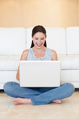 Buy stock photo Happy woman, laptop and typing for social media, communication or networking on floor at home. Female person, writer or freelancer smile on computer for online research, browsing or email at house