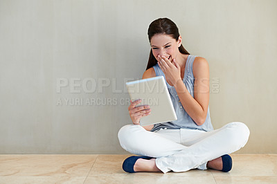 Buy stock photo Happy woman, tablet and laughing for funny joke, social media or meme sitting on floor at home. Female person, brunette or freelancer smile and giggling with technology for humor or comedy on mockup
