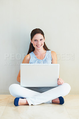 Buy stock photo Happy woman, portrait and laptop for social media, communication or networking at home. Female person or freelancer smile and sitting against wall on computer for online research on mockup space