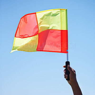 Buy stock photo Flag, stop and soccer referee in football match or game wave a foul sign during sport training or workout. Hand, sports and person or assistant official raise or signal mistake in sky background