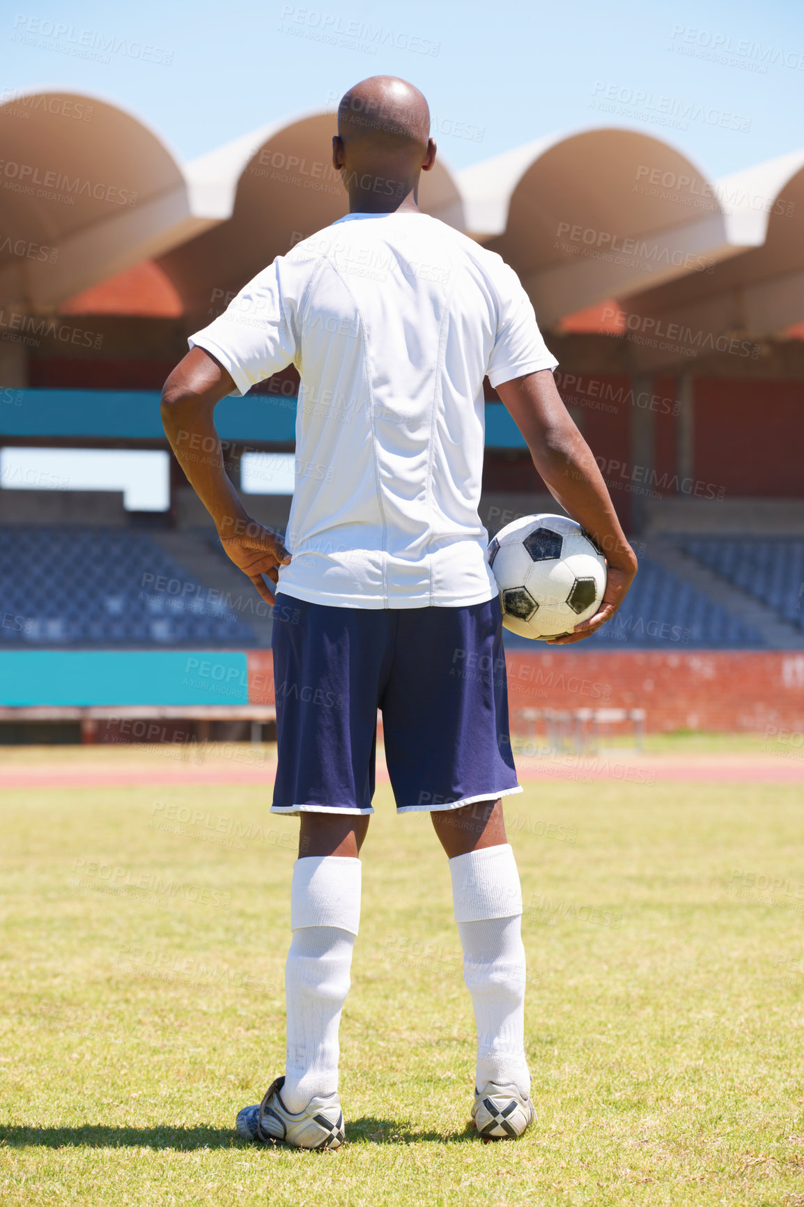 Buy stock photo Man, soccer ball and back on stadium field with thinking, strong or ready for competition, contest or health. Football player, person or memory on pitch for fitness, exercise or workout for wellness