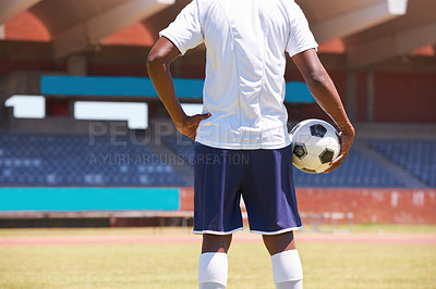Buy stock photo Man, holding soccer ball and back in stadium for game, competition or outdoor for sports career. Football player, ready and motivation for sport, workout and exercise for health, wellness and contest