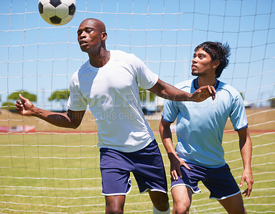 Buy stock photo Men, sport and soccer with header, ball and contest for defender and striker on field for wellness. Man, football player and competition to stop goal, exercise or training together for health outdoor