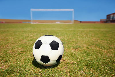 Buy stock photo Soccer ball, empty field and goal on ground for shooting, free kick and competition for sports in summer. Football, grass or pitch by net, frame or sunshine for training, exercise or workout in game