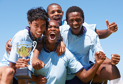 Buy stock photo Men, sports and team with trophy on field for achievement, goal or diversity for training, exercise or contest. People, group and hug for celebration, cheers or excited for champion in soccer game