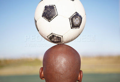 Buy stock photo Man, sports and balance soccer ball on head, back and outdoor for training, exercise and progress. Footballer player, workout and fitness with skill, health and wellness on pitch, grass or stadium