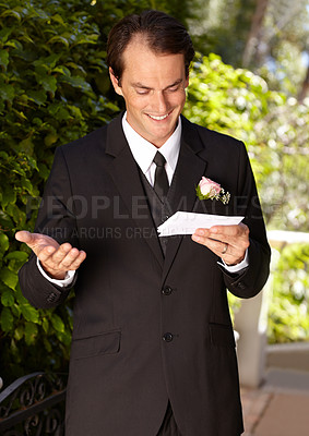 Buy stock photo Man, vows and outdoor at wedding ceremony for marriage commitment, promise speech or romance party. Male person, paper and reading as groom for partnership celebration, relationship trust or love