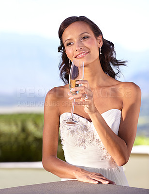 Buy stock photo Beautiful young bride holding a glass of champagne
