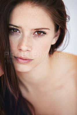 Buy stock photo Closeup of a gorgeous young woman with perfect skin looking at you confidently