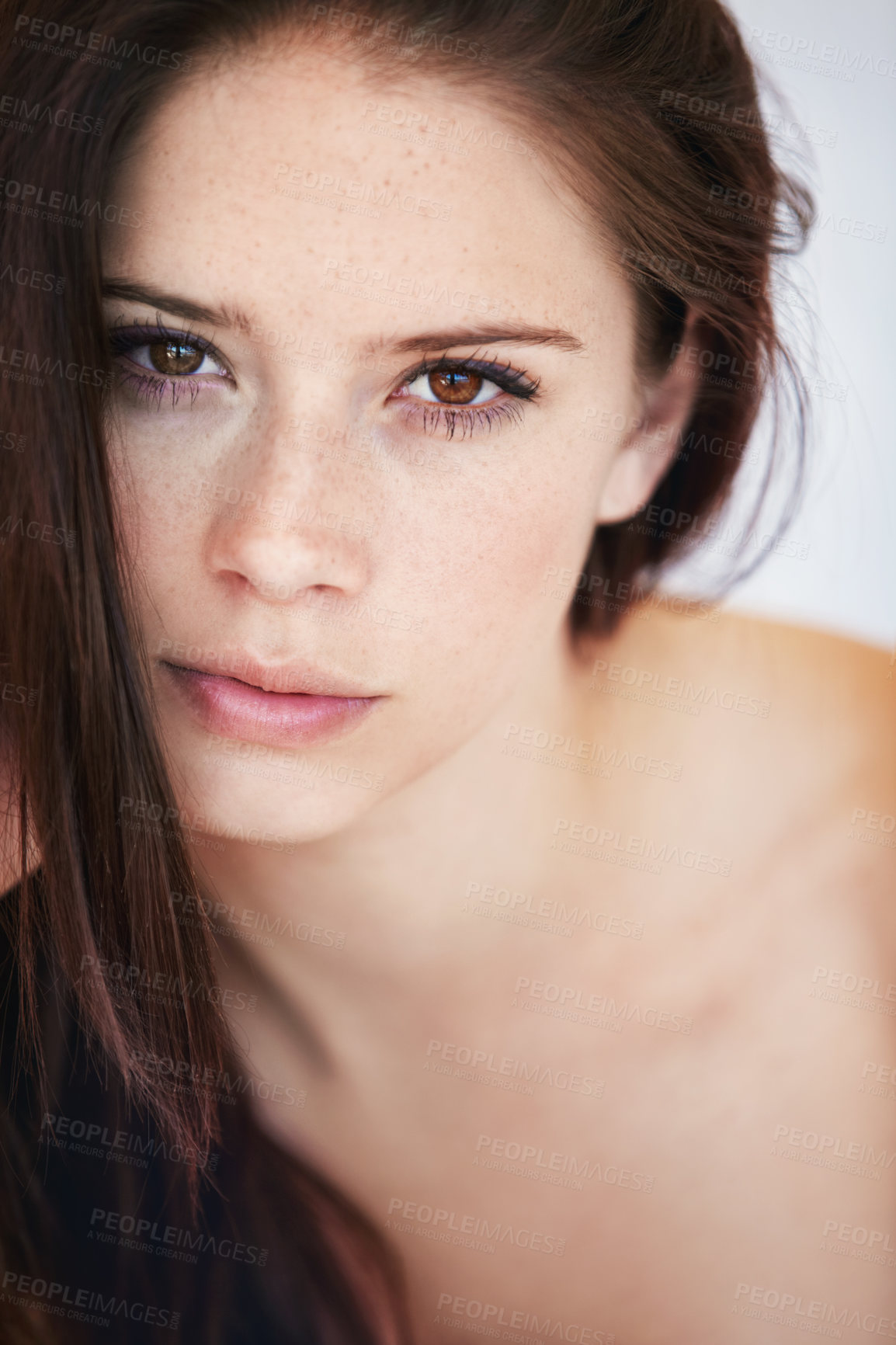 Buy stock photo Closeup of a gorgeous young woman with perfect skin looking at you confidently