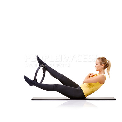 Buy stock photo Woman, pilates ring and legs for balance exercise for resistance training, strong core or studio white background. Female person, equipment for thigh muscle wellbeing or abs workout, health or mockup