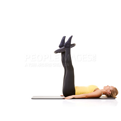 Buy stock photo Woman, pilates ring and legs for workout on yoga mat for resistance training, strong thighs or studio white background. Female person, equipment for muscle flexibility or exercise, health or mockup