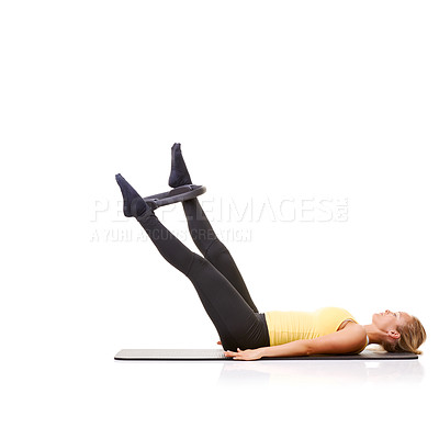 Buy stock photo Woman, pilates ring and legs for stretching on yoga mat or resistance training, strong thighs or studio white background. Female person, equipment for muscle flexibility or exercise, health or mockup